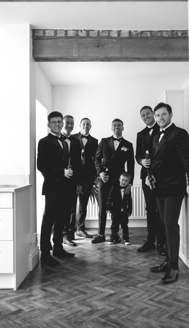 Groomsmen lined up in suits