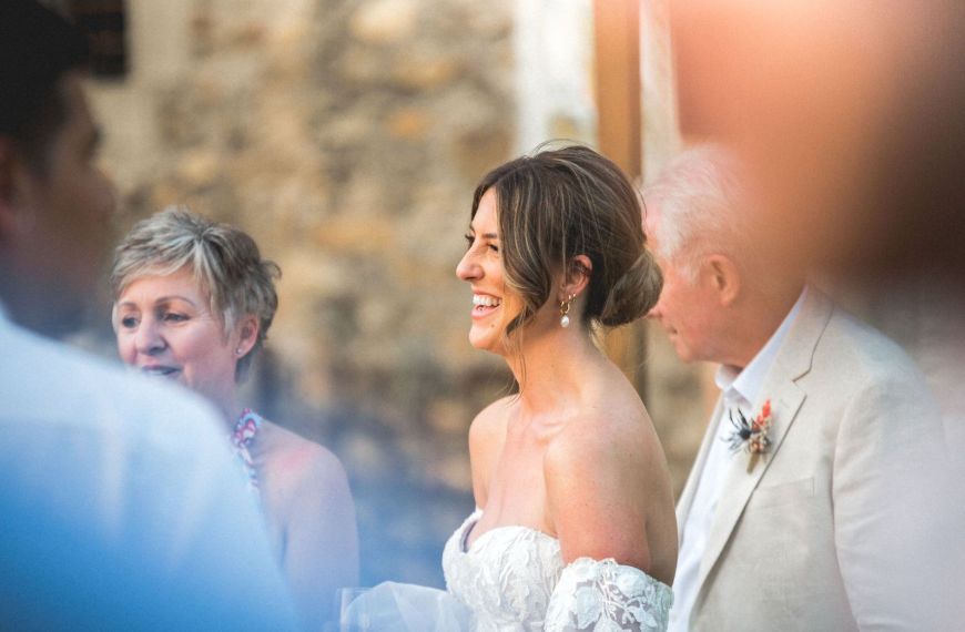 Bride laughing with a guest